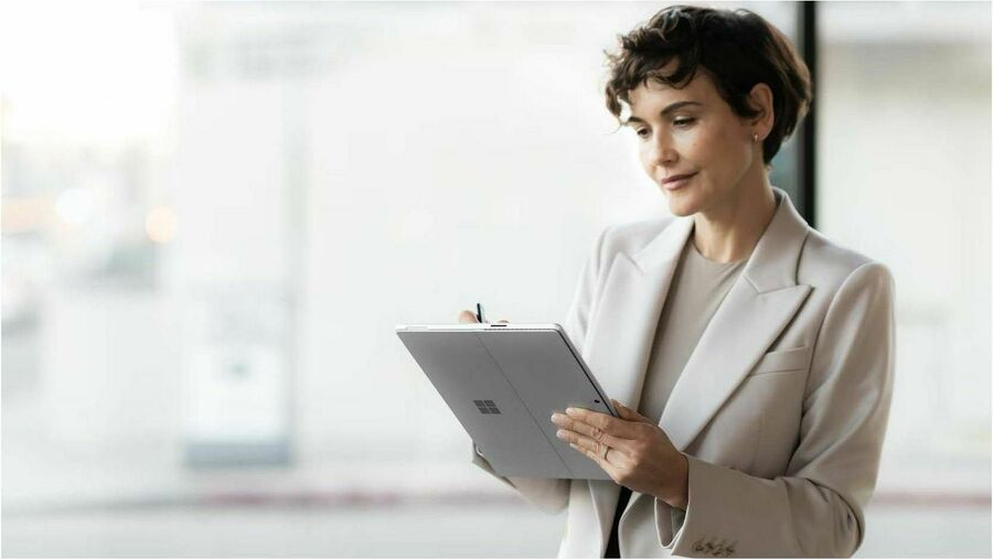 Man typing on Microsoft Surface Device